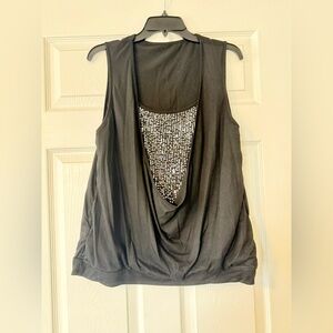 Shein. Gently used sequin and black shirt. It’s from SHEIN. Size 2XL.